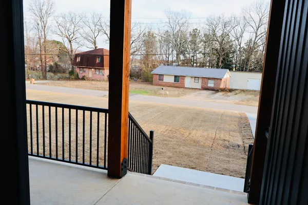 a kitchen with a refrigerator and a stove