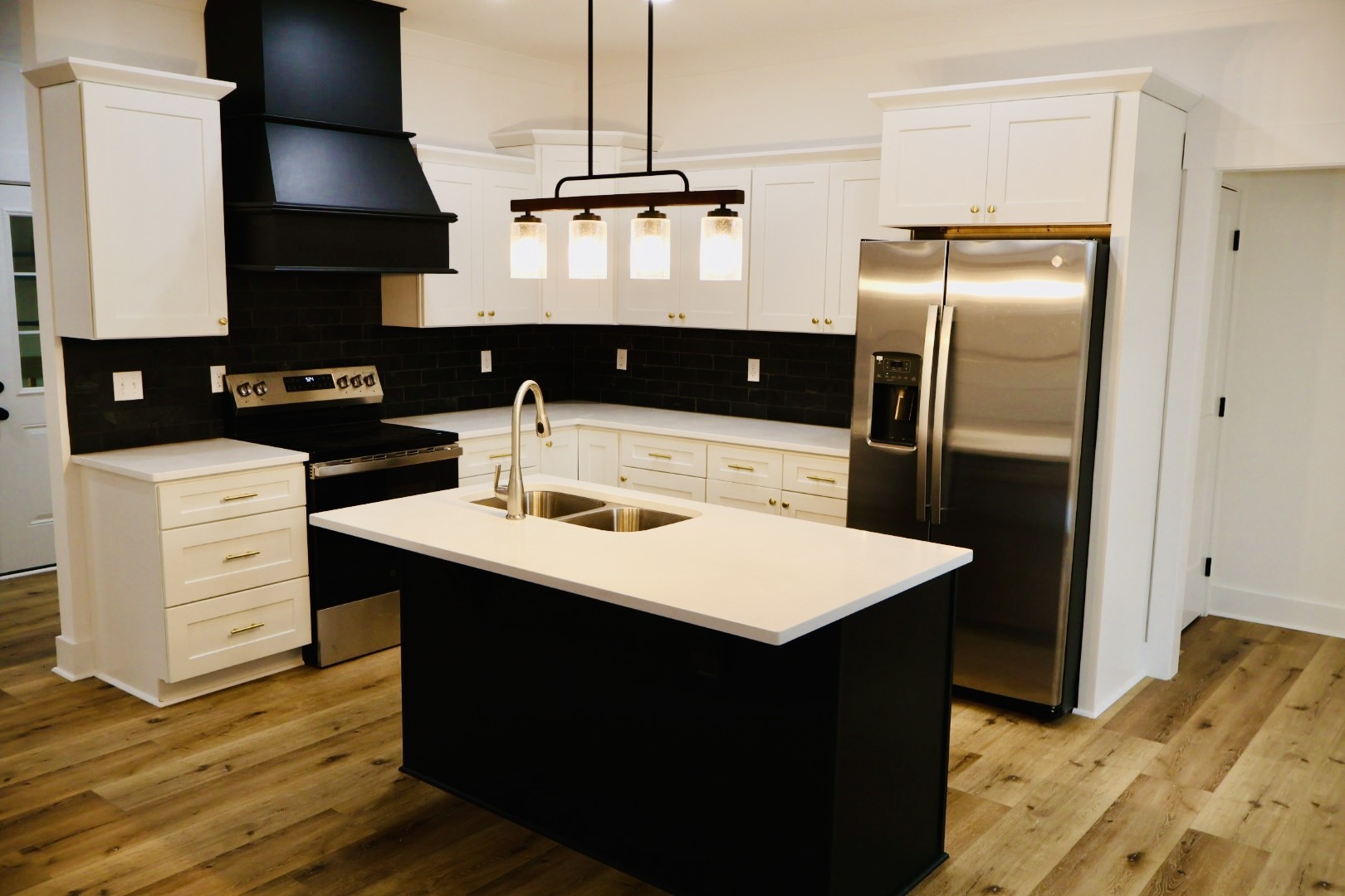 62 Hall Street Lexington, TN 38351 - Photo 10 of 48 a kitchen with a refrigerator and a stove