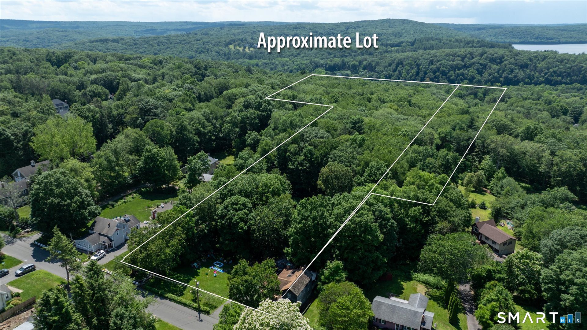 1-3 Verville Road Avon, CT 06001 - Photo 3 of 6 a view of a field with plants and large trees