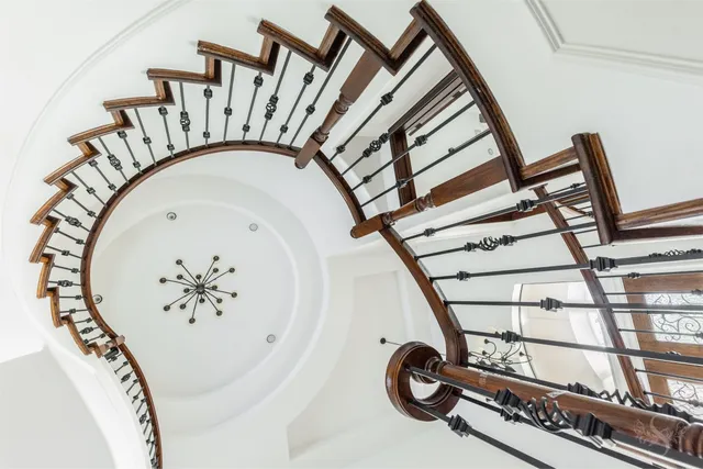 a view of an empty room with a kitchen