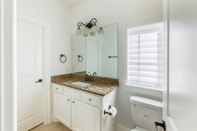 a view of house with swimming pool and yard