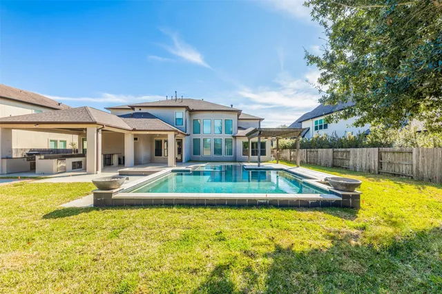a view of a house with a swimming pool