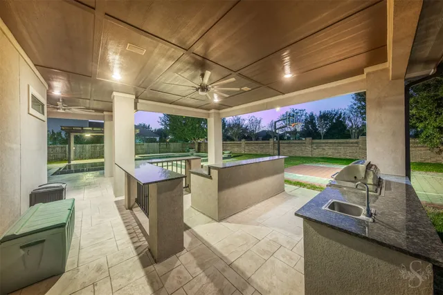 a view of a patio with a table and chairs