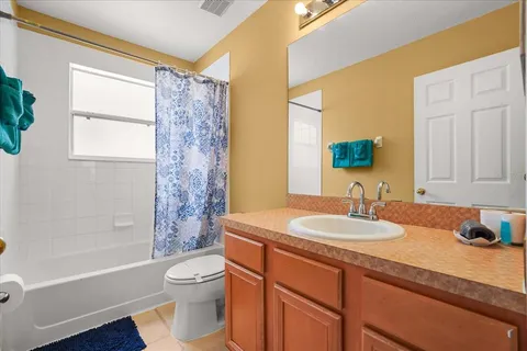 a view of washer and dryer with kitchen in the background