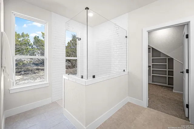 a view of an empty room with a window