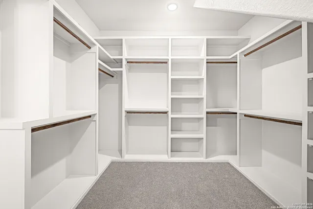 a view of an empty walk in closet