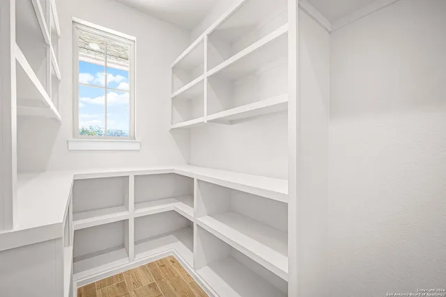 a view of an empty walk in closet