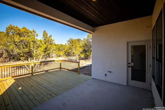 a view of a balcony with wooden floor