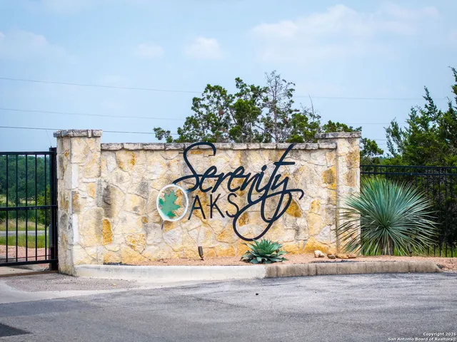 a park view with wooden fence and trees