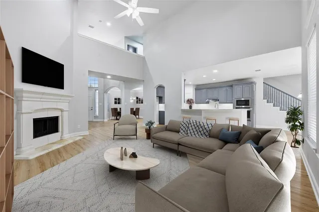 a living room with furniture fireplace and flat screen tv
