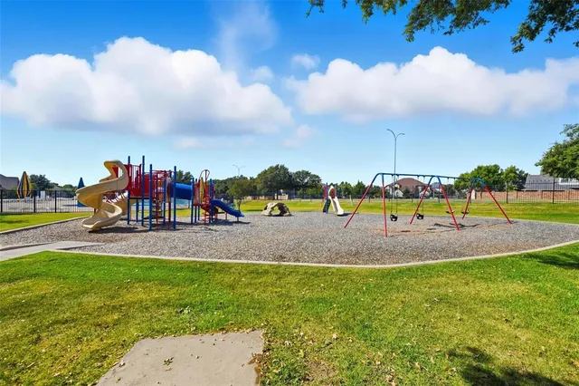 a view of a golf course with a house