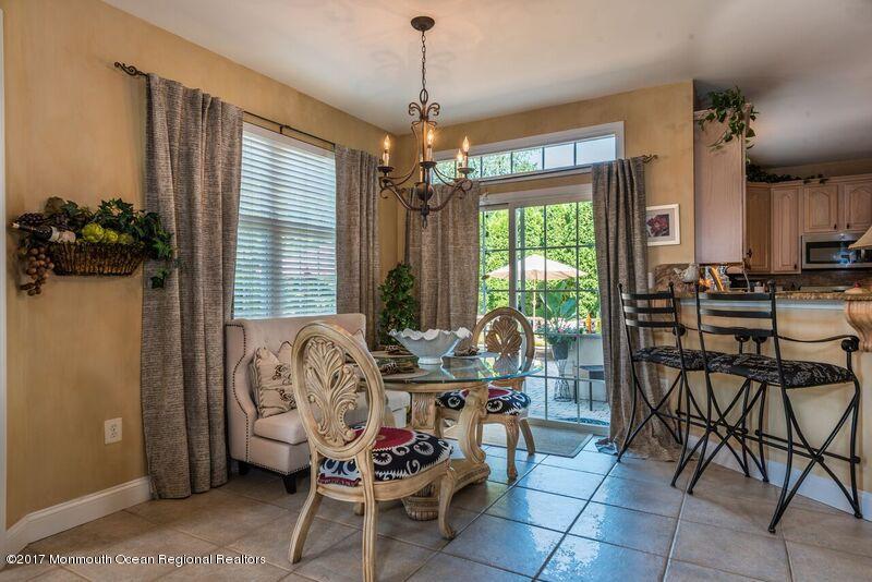 8 Rodeo Drive Jackson, NJ 08527 - Photo 11 of 54 a living room with furniture and a chandelier