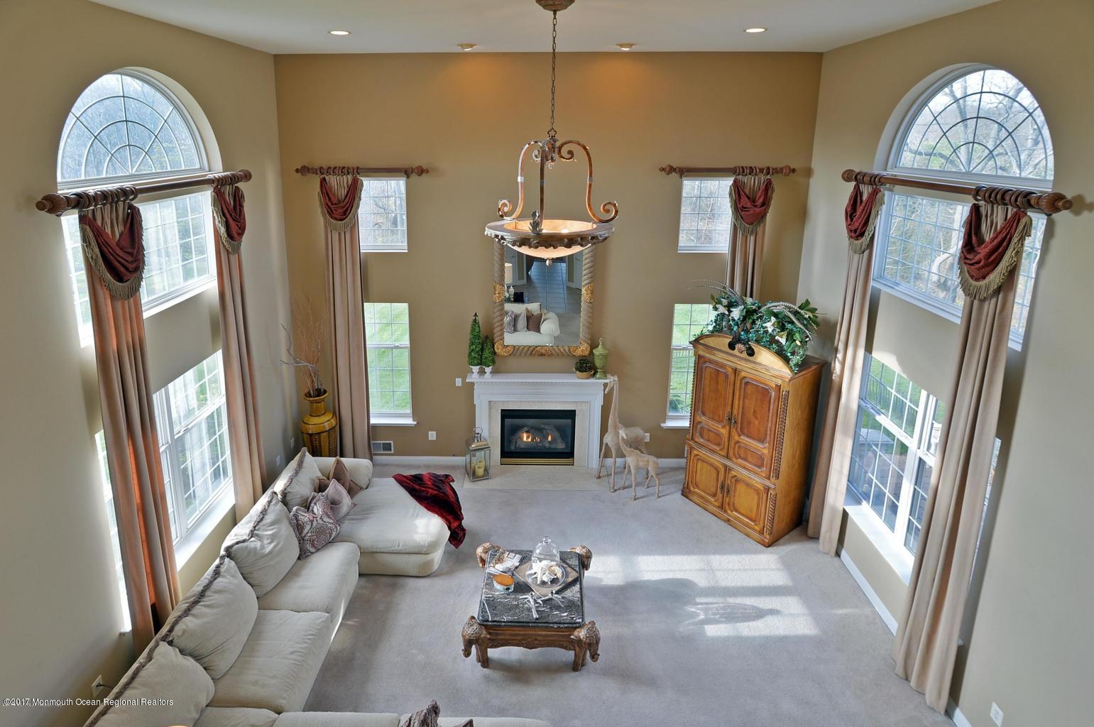 8 Rodeo Drive Jackson, NJ 08527 - Photo 14 of 54 a living room with furniture and a fireplace