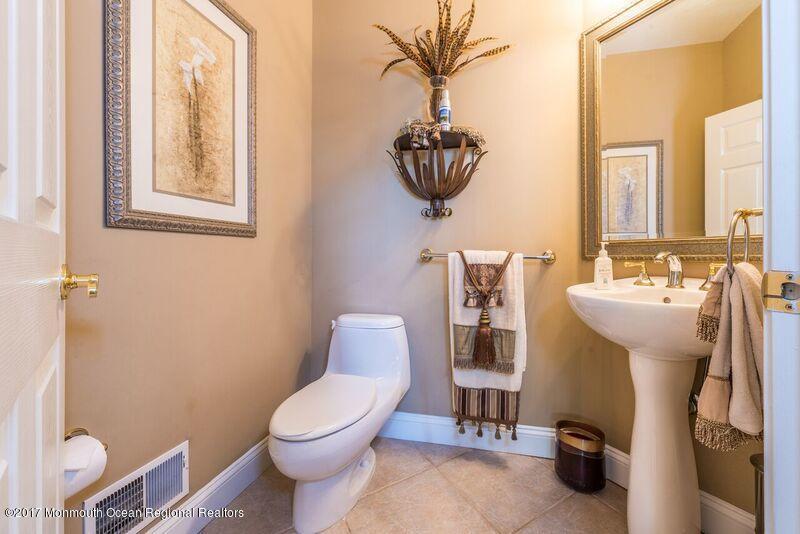 8 Rodeo Drive Jackson, NJ 08527 - Photo 18 of 54 a bathroom with a toilet sink and mirror