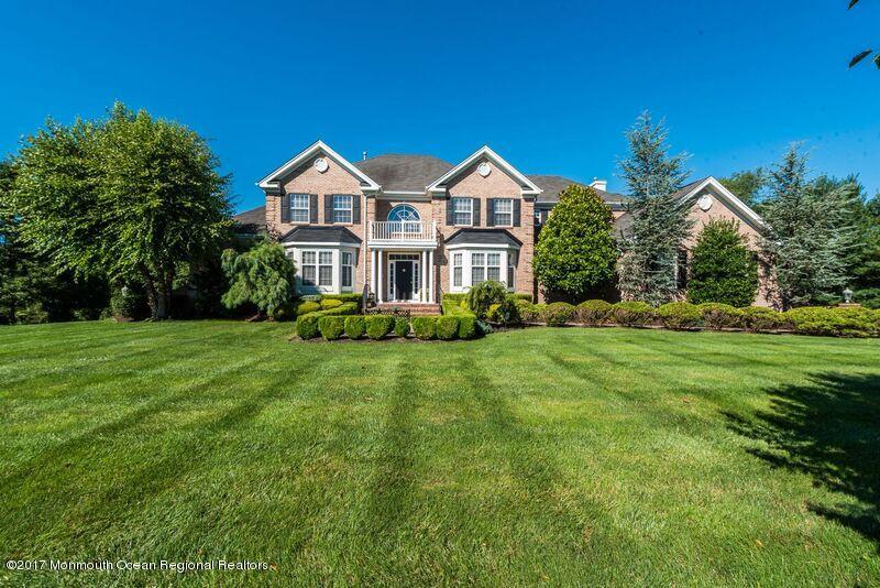 8 Rodeo Drive Jackson, NJ 08527 - Photo 2 of 54 a front view of a house with a yard and green space