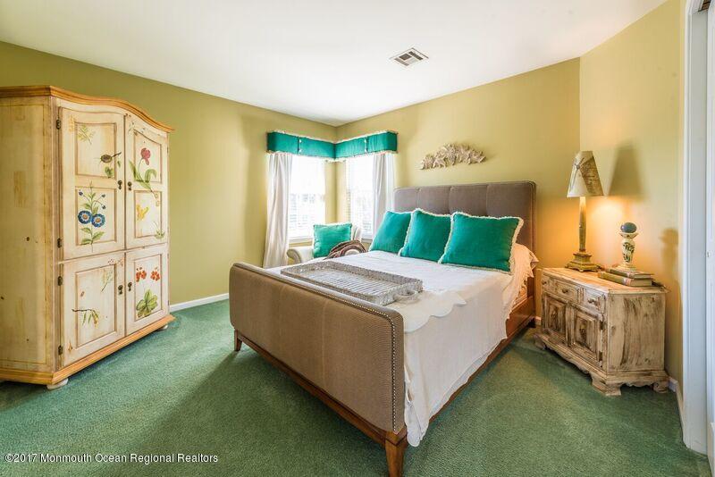 8 Rodeo Drive Jackson, NJ 08527 - Photo 24 of 54 a bedroom with a bed and a painting on the wall
