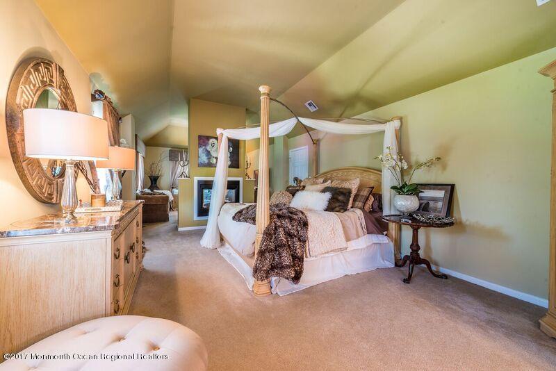 8 Rodeo Drive Jackson, NJ 08527 - Photo 26 of 54 a bed room with a bed and a chair