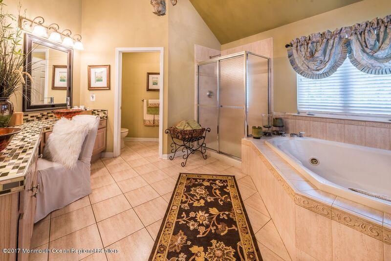 8 Rodeo Drive Jackson, NJ 08527 - Photo 32 of 54 a bathroom with a bathtub and a shower