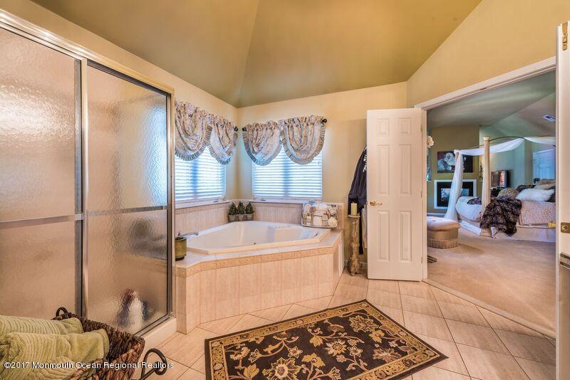8 Rodeo Drive Jackson, NJ 08527 - Photo 33 of 54 a bathroom with a sink and a mirror