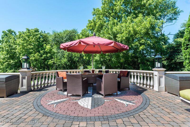 8 Rodeo Drive Jackson, NJ 08527 - Photo 34 of 54 a view of a patio with a table and chairs