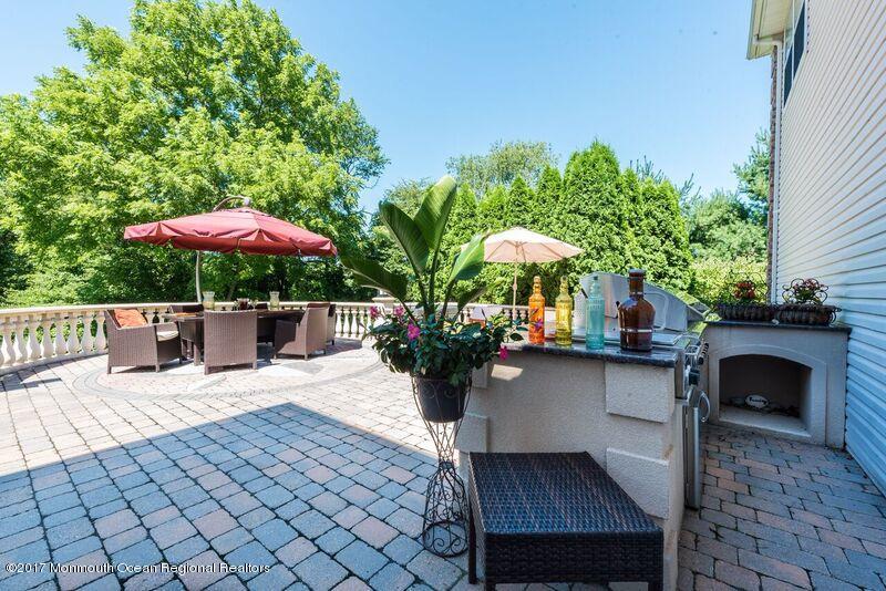 8 Rodeo Drive Jackson, NJ 08527 - Photo 35 of 54 a view of a patio with furniture and a potted plants