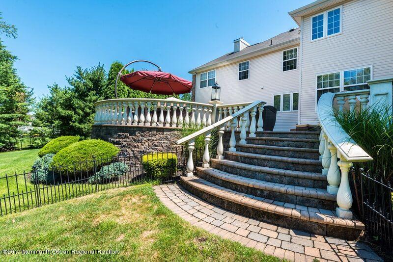 8 Rodeo Drive Jackson, NJ 08527 - Photo 42 of 54 a view of a house with a small yard plants and large trees