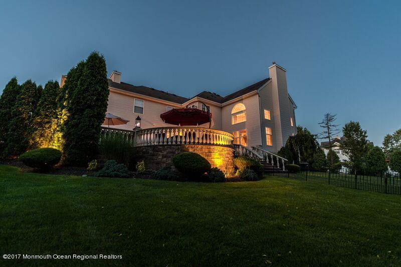 8 Rodeo Drive Jackson, NJ 08527 - Photo 47 of 54 a front view of a house with a garden and yard