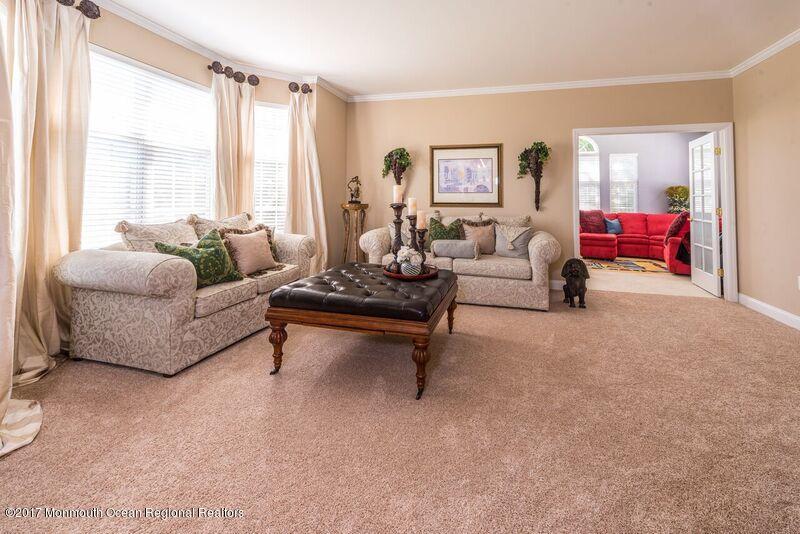 8 Rodeo Drive Jackson, NJ 08527 - Photo 8 of 54 a living room with furniture and a large window