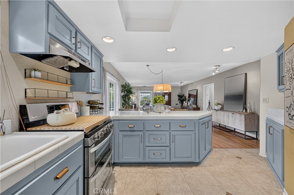 4023 East Ransom Street Long Beach, CA 90804 - Photo 11 of 40 From the kitchen, you can talk with your guests/family in the dining and living areas.