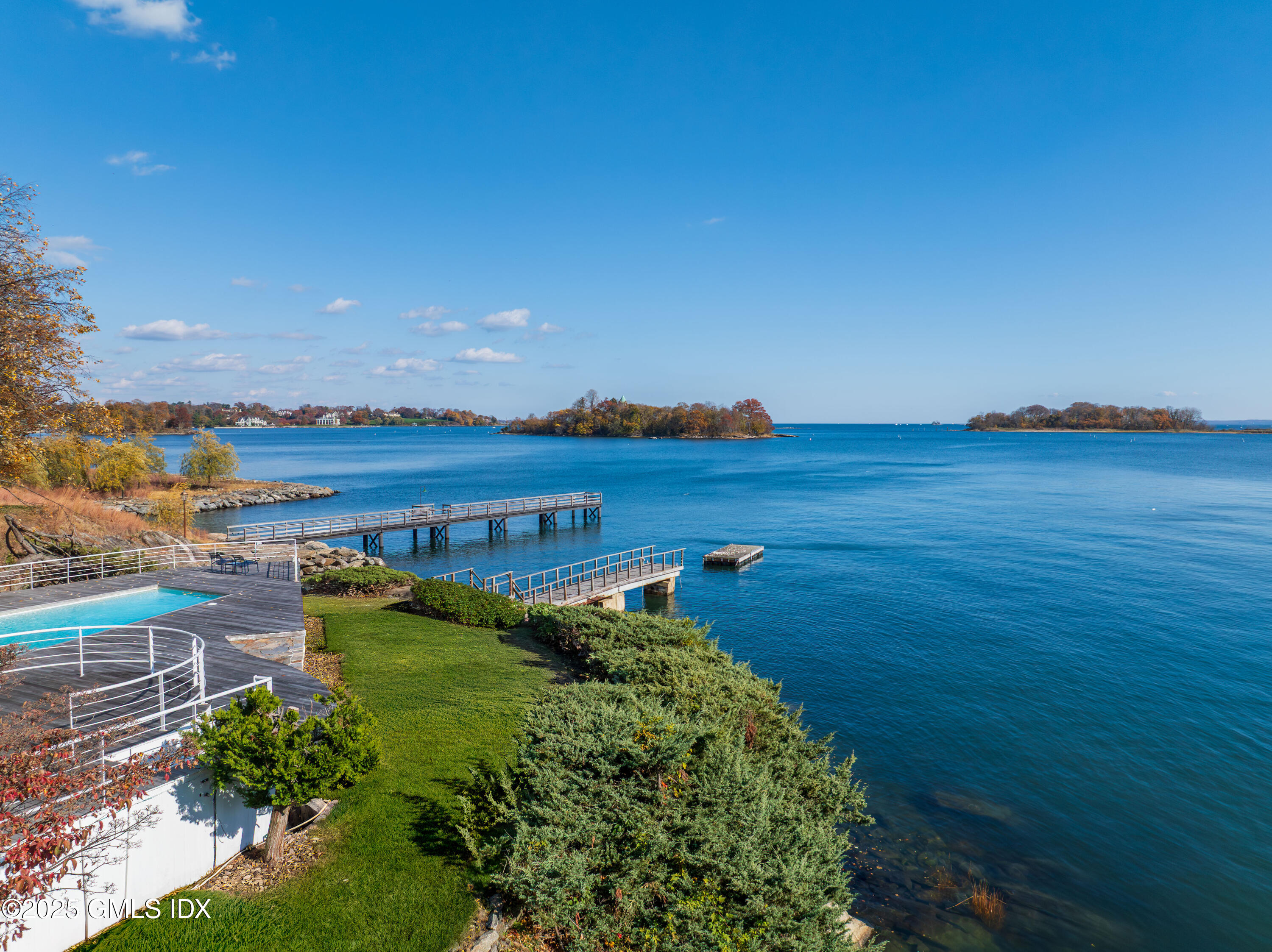 111 Byram Shore Road Greenwich, CT 06830 - Photo 5 of 23 a view of a lake with a big yard