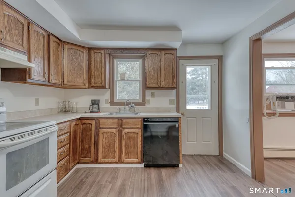 a kitchen with a refrigerator stove and sink