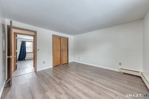 a view of a porch with wooden floor