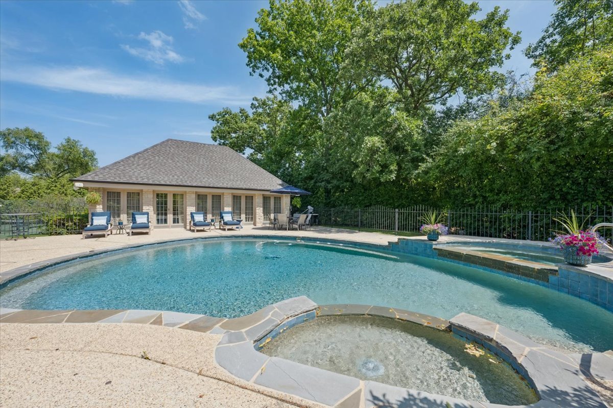 2311 Burr Oak Road Northfield, IL 60093 - Photo 42 of 69 a view of a house with swimming pool and a yard