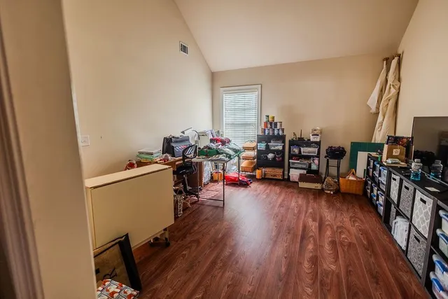 a view of a room with workspace and a window