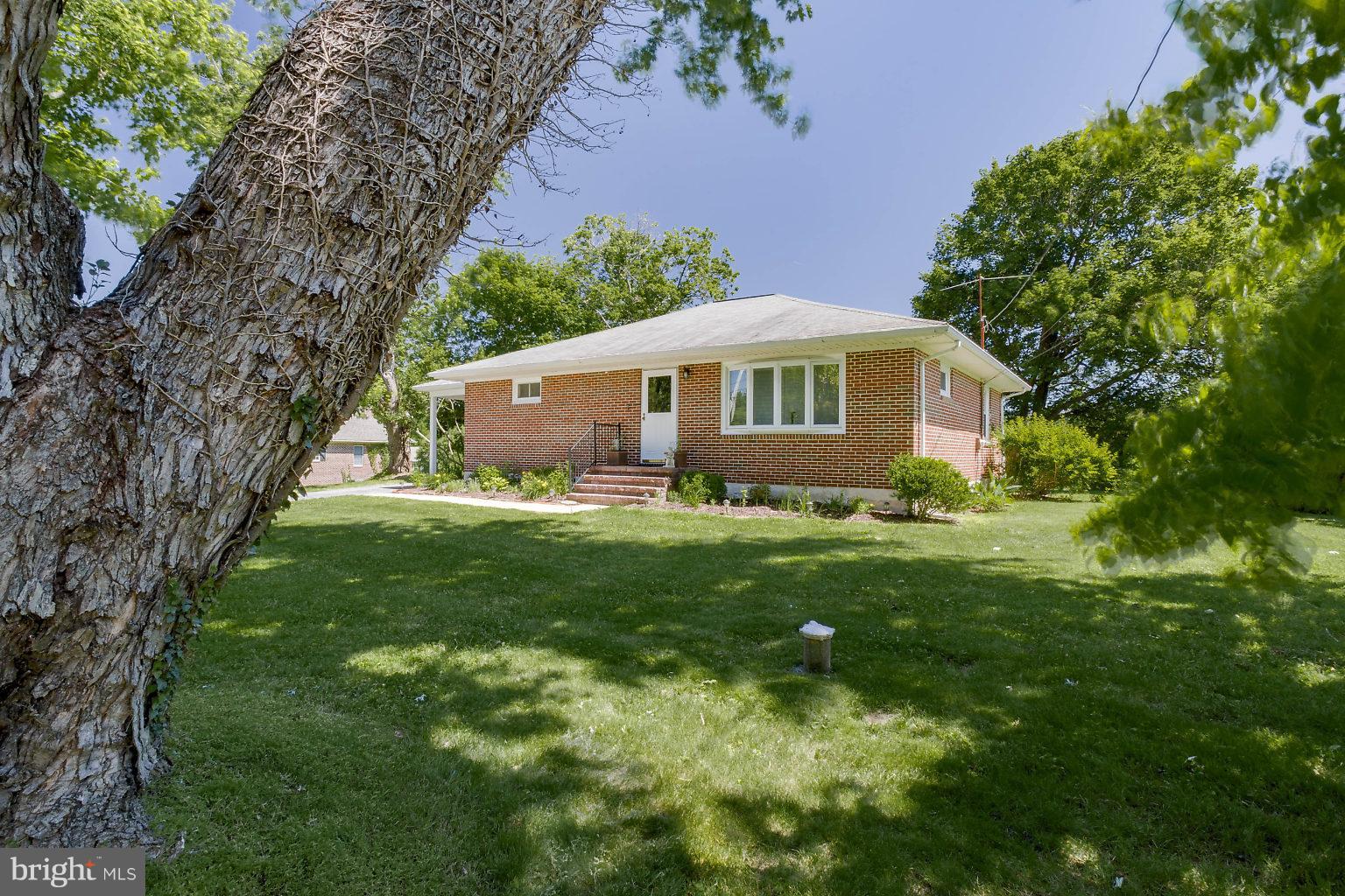 8414 Dogwood Road Baltimore, MD 21244 - Photo 2 of 29 a front view of house with yard and green space