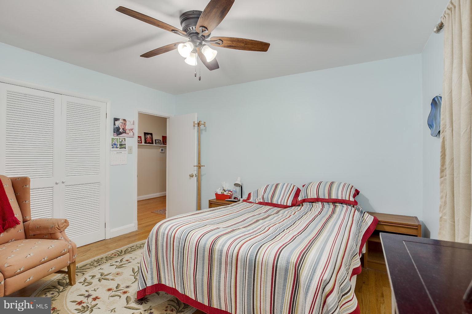 8414 Dogwood Road Baltimore, MD 21244 - Photo 13 of 29 a bedroom with a bed and a couch