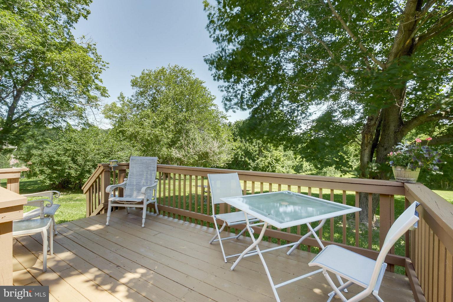 8414 Dogwood Road Baltimore, MD 21244 - Photo 18 of 29 a view of balcony with wooden floor and outdoor seating