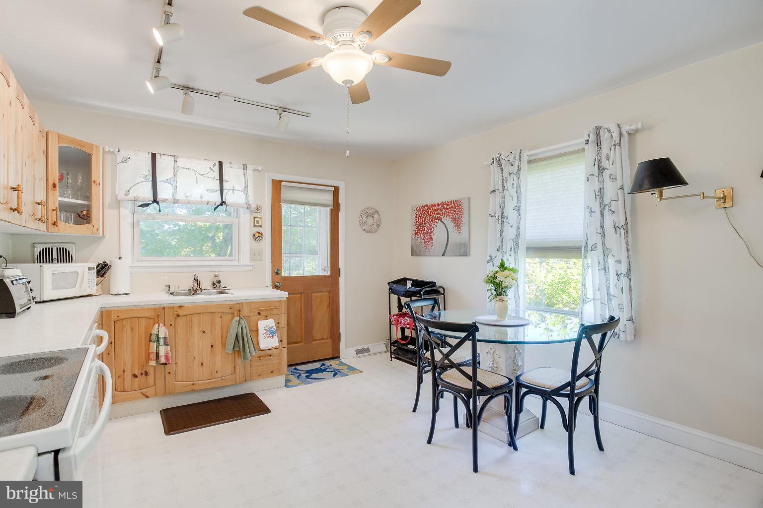 8414 Dogwood Road Baltimore, MD 21244 - Photo 19 of 29 a view of a dining room with furniture window and outside view