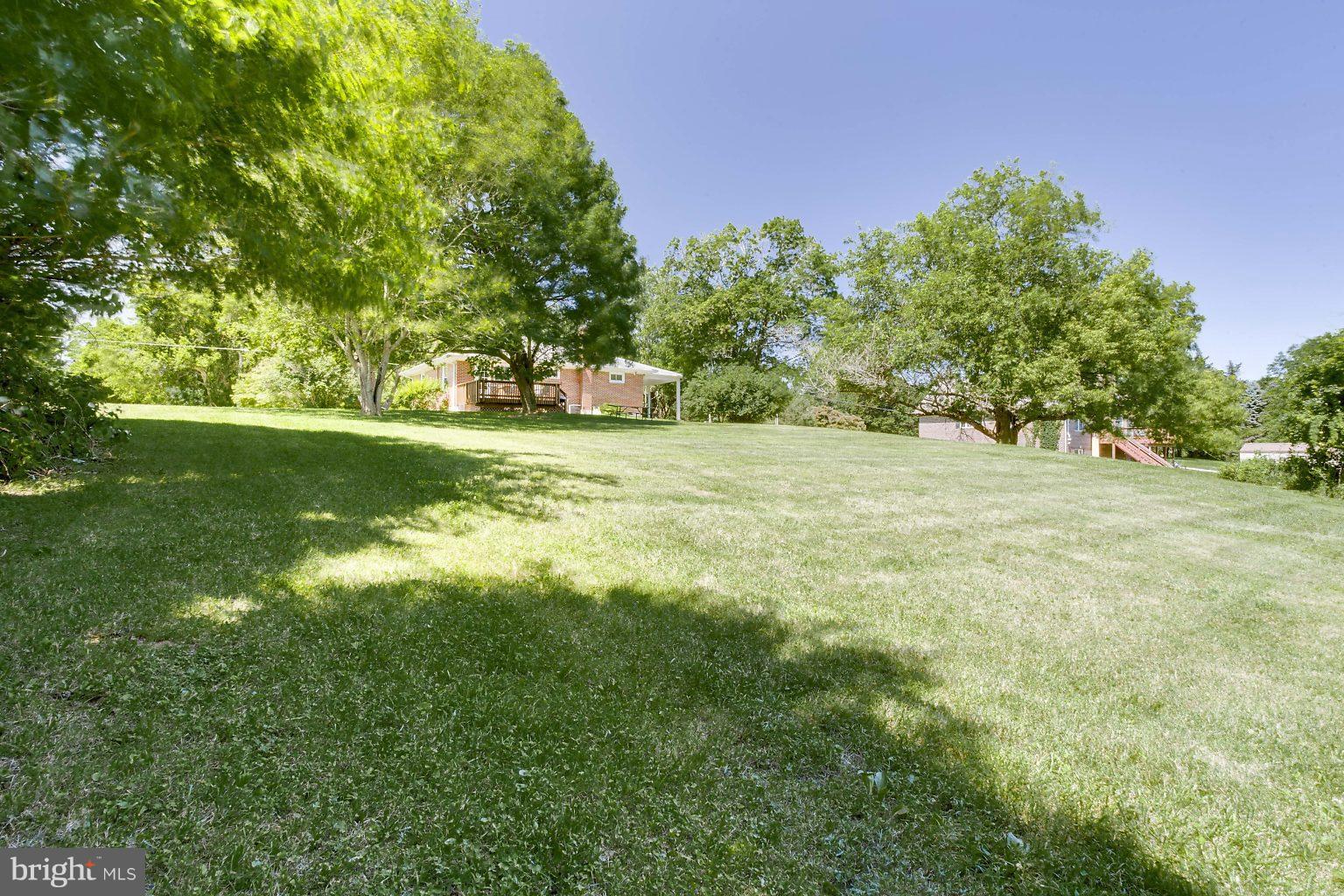 8414 Dogwood Road Baltimore, MD 21244 - Photo 29 of 29 a view of a field with a tree in the background