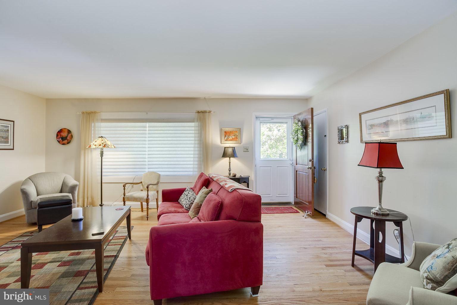 8414 Dogwood Road Baltimore, MD 21244 - Photo 5 of 29 a living room with furniture and a wooden floor