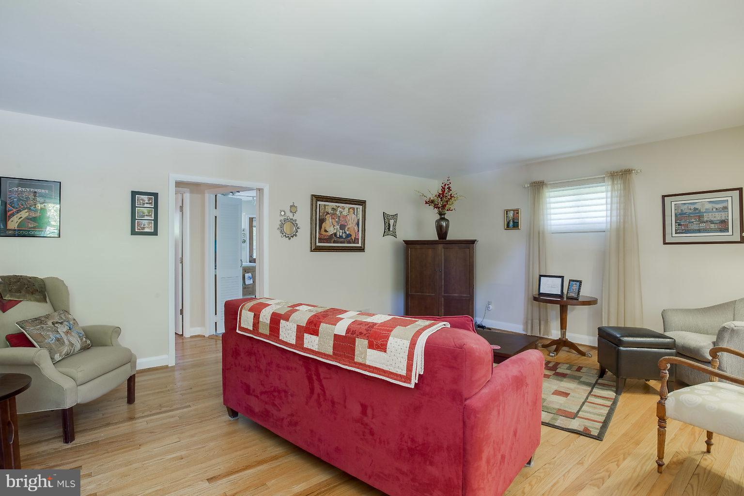 8414 Dogwood Road Baltimore, MD 21244 - Photo 6 of 29 a living room with furniture fireplace and a window