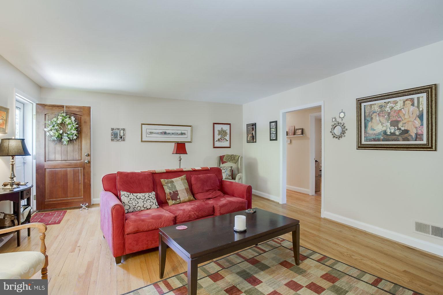 8414 Dogwood Road Baltimore, MD 21244 - Photo 8 of 29 a living room with furniture and wooden floor