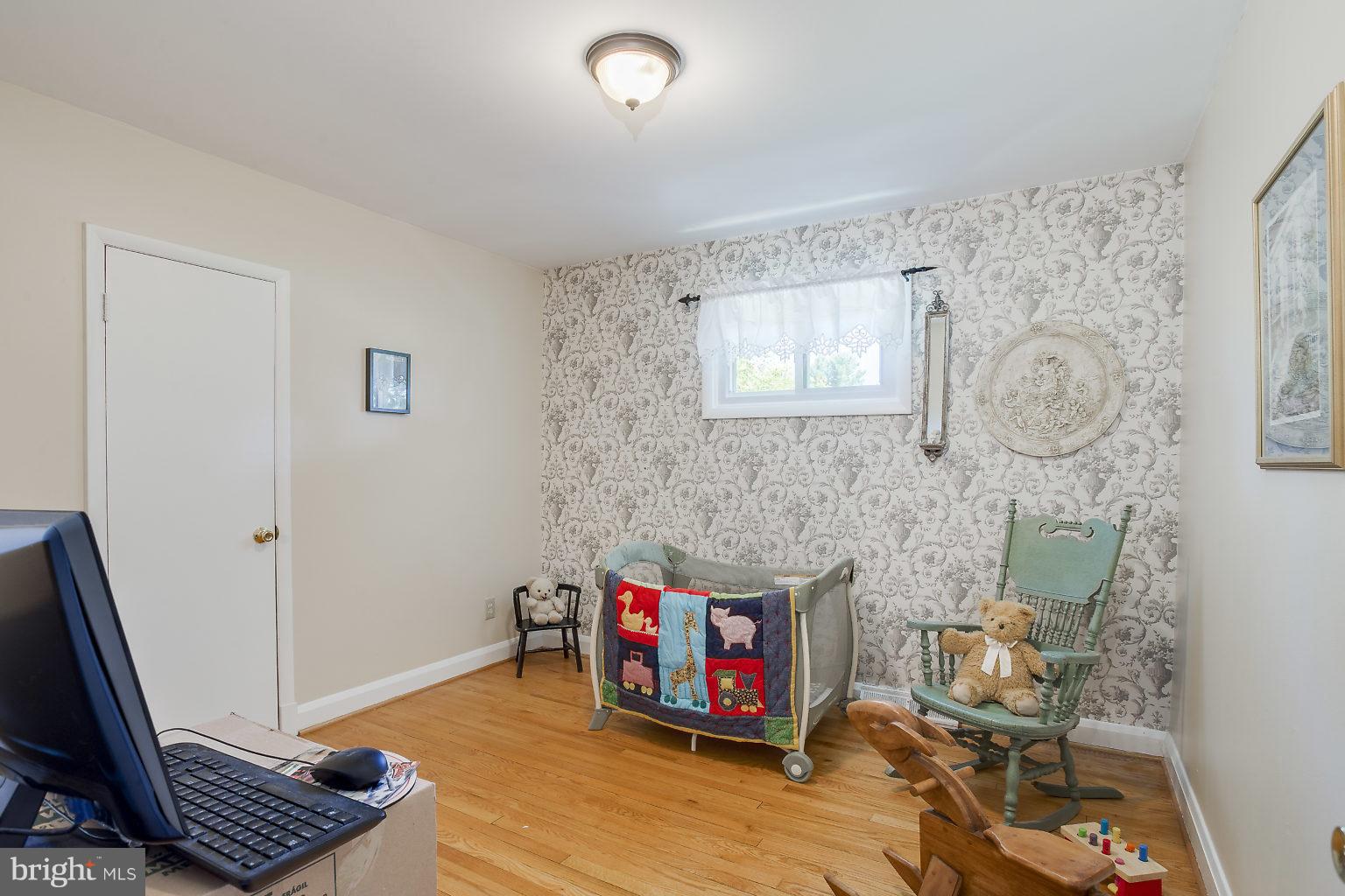 8414 Dogwood Road Baltimore, MD 21244 - Photo 9 of 29 a living room with couch and a window