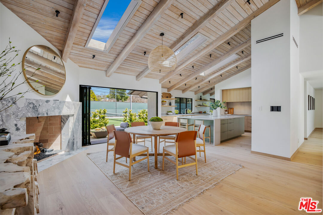 1508 Old Oak Road Los Angeles, CA 90049 - Photo 13 of 63 a view of a dining room with furniture window and outside view
