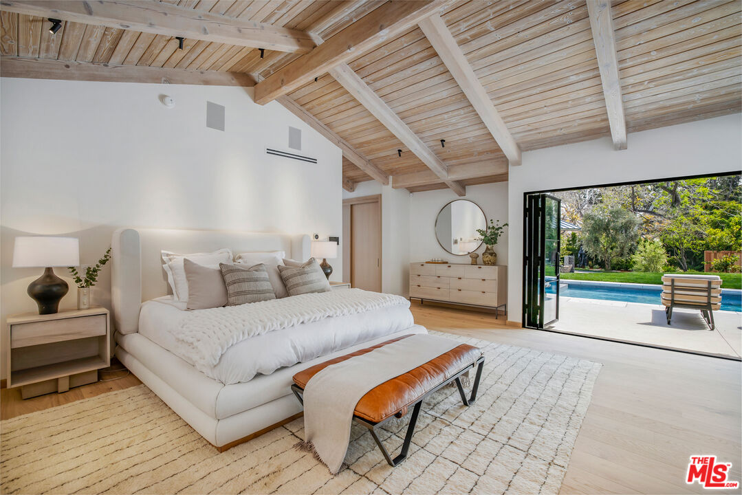 1508 Old Oak Road Los Angeles, CA 90049 - Photo 17 of 63 a bedroom with bed and a large window