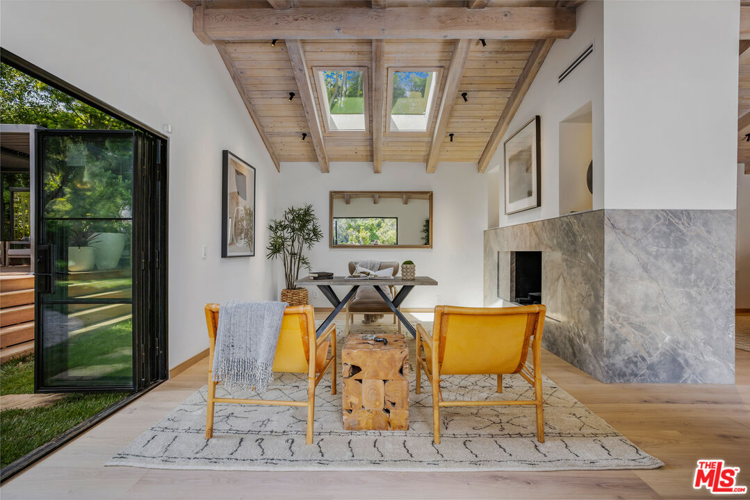 1508 Old Oak Road Los Angeles, CA 90049 - Photo 20 of 63 a view of an chairs and table in the patio