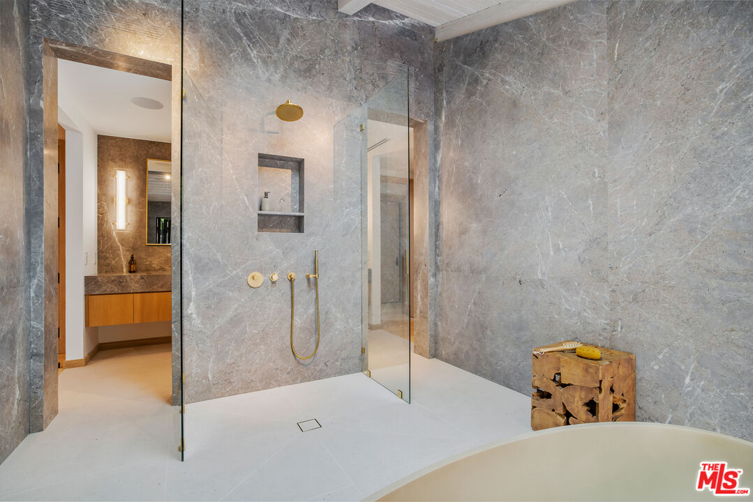 1508 Old Oak Road Los Angeles, CA 90049 - Photo 23 of 63 a bathroom with a tub and shower