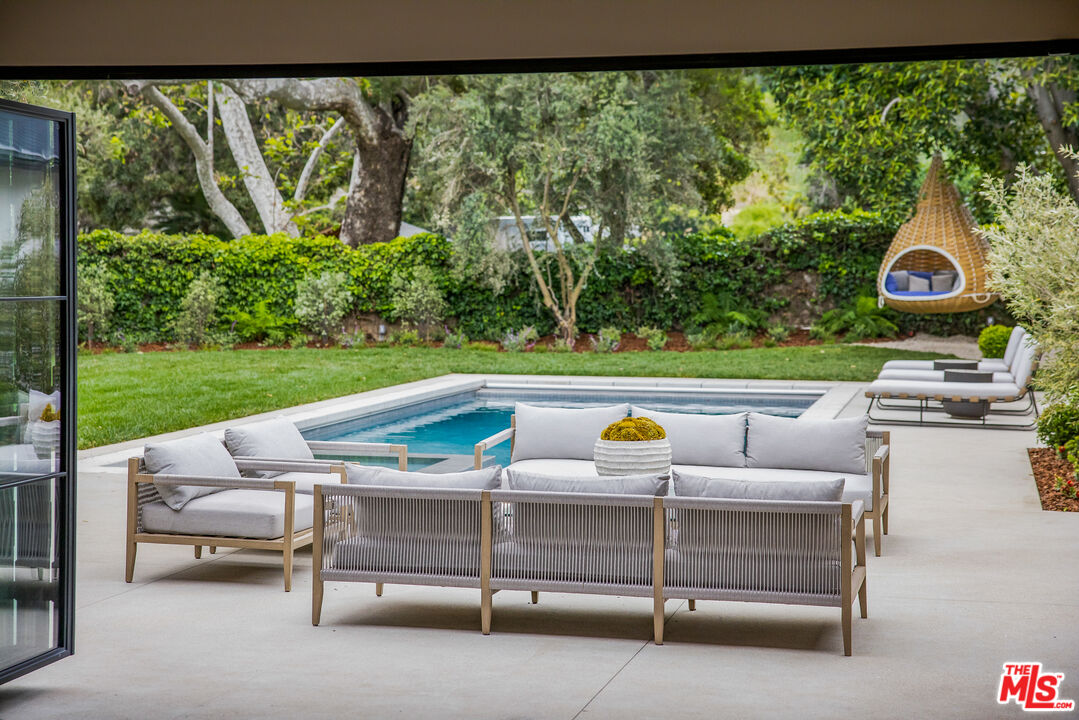 1508 Old Oak Road Los Angeles, CA 90049 - Photo 38 of 63 a view of outdoor sitting area with furniture and garden