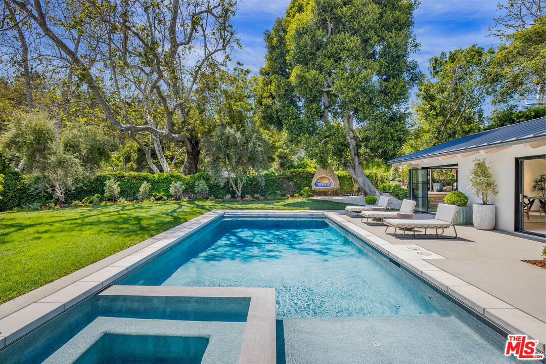 1508 Old Oak Road Los Angeles, CA 90049 - Photo 40 of 63 a view of swimming pool with chairs