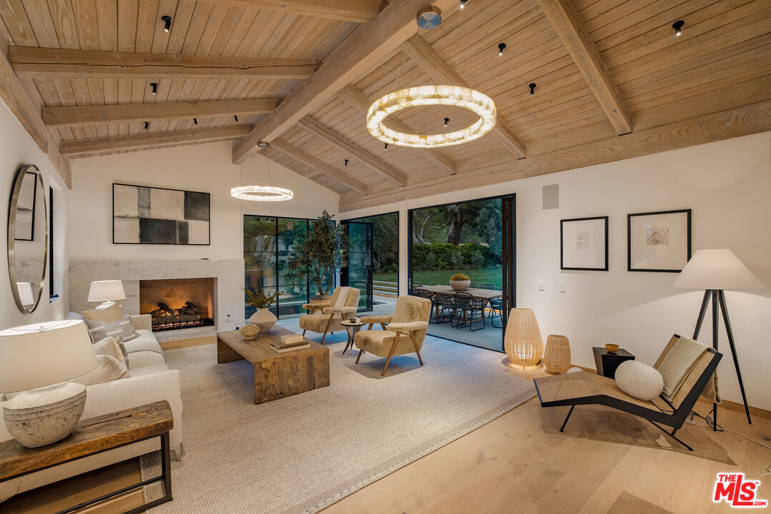 1508 Old Oak Road Los Angeles, CA 90049 - Photo 52 of 63 a living room with furniture chandelier and fireplace
